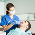 Can dental assistants clean teeth?